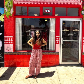Artist Jiyan Rios Zandi stands outside of her shop, Brown Local Baby, on July 9, 2026.
