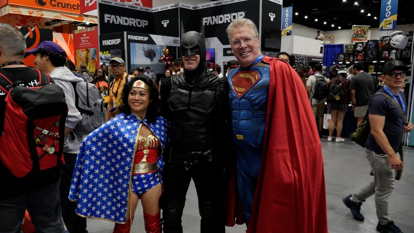 A cosplaying trifecta of superheroes (Wonder Woman, Batman and Superman) gather for a photo on July 24, 2025.