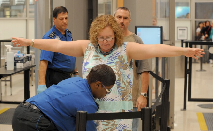 Transportation Security Administration screeners check passengers at Hartsfield-Jackson Atlanta International Airport in Atlanta last month. The TSA was created after the Sept. 11, 2001, terrorist attacks.