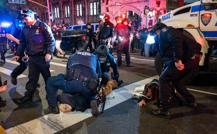 Police arrest protesters during pro-Palestinian demonstrations at The City College Of New York as the NYPD cracks down on protest camps at both Columbia University and CCNY on April 30, in New York City.