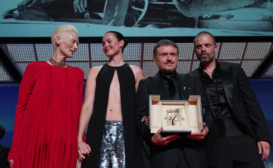 Left to right: Tilda Swinton poses with Renate Reinsve, Cristian Mungiu — winner of the Palme d'Or for Fjord — and Sebastian Stan, during the awards ceremony at the 79th Cannes international film festival, in southern France, on Saturday.