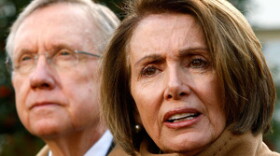 U.S. Speaker of the House Rep. Nancy Pelosi (D-CA) speaks to the media as Senate Majority Leader Sen. Harry Reid (D-NV) listens after a meeting with President Barack Obama, December 9, 2009 at the White House in Washington, D.C.