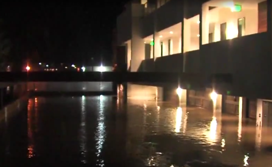 The garages of an Ocean Beach apartment complex are flooded, Jan. 5, 2016.