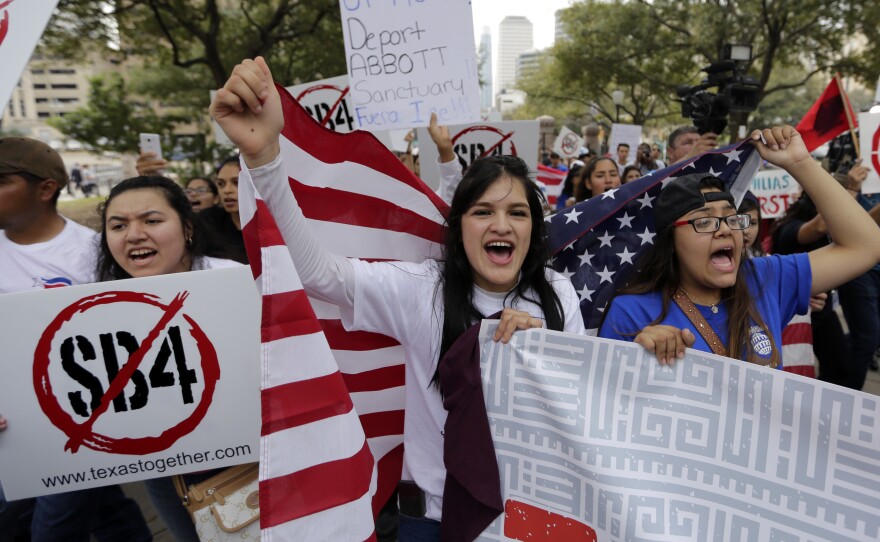 Protesters in Texas denouncing SB4, that state's law banning "sanctuary cities."