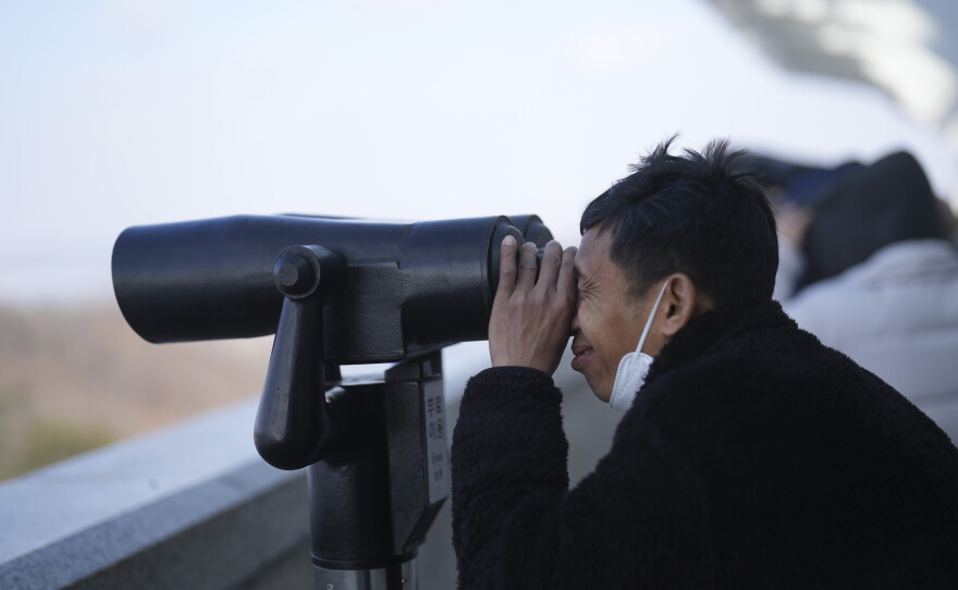 A visitor watches North Korean side from the unification observatory in Paju, South Korea, Wednesday, Jan. 29, 2025.