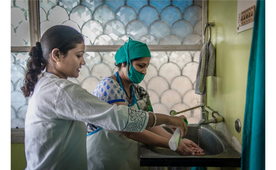 Dr. Mahesh prepares to carry out an abortion for Palo Khoya. "They just come because they don't want to continue the pregnancy," the doctor says. "They're not bothered whether it's legal or not legal. But we're doing awareness campaigns to tell them it's legal, it's not wrong, to get rid of the stigma attached to it."