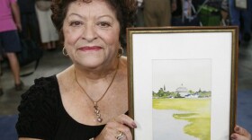 At ANTIQUES ROADSHOW in Hartford, Connecticut, this guest wows appraiser Kathleen Guzman with a signed watercolor by Katharine Hepburn. A gift to the guest from Hepburn when she performed at the American Shakespeare Theater in Stratford, Connecticut, the charming painting's creator and original signature boost its value to $15,000 to $20,000.