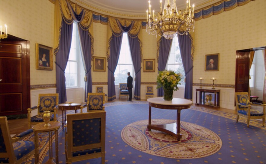 Wide shot of Blue Oval Room with White House Curator Bill Allman standing at window looking out, White House, Washington D.C.
