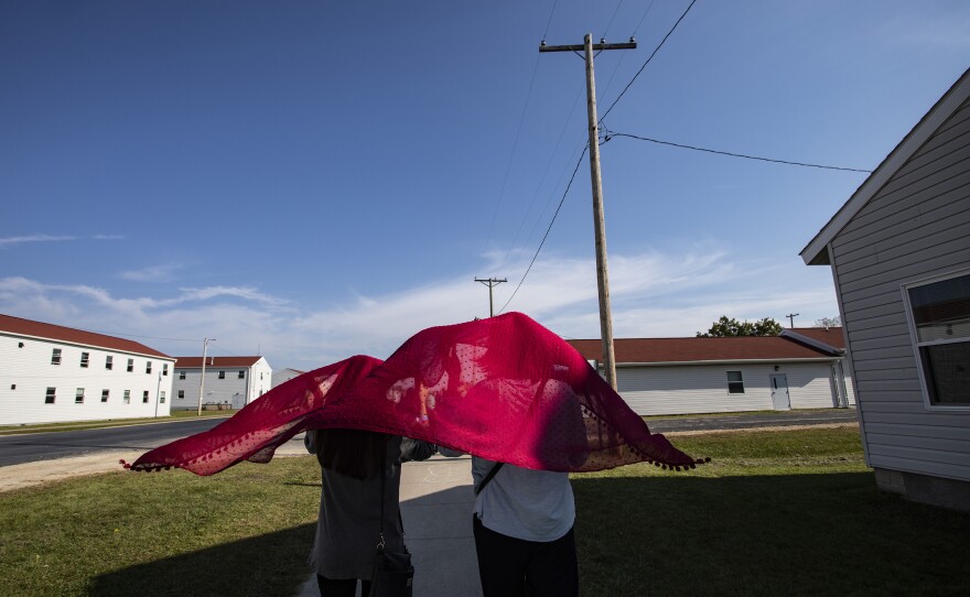 Young Afghan refugees walk through the Village at the Ft. McCoy U.S. Army base on September 30, 2021 in Ft. McCoy, Wisconsin. The Village is the community housing for the Afghans, comprised of eight neighborhoods where the evacuees live, eat, and receive services and support.
