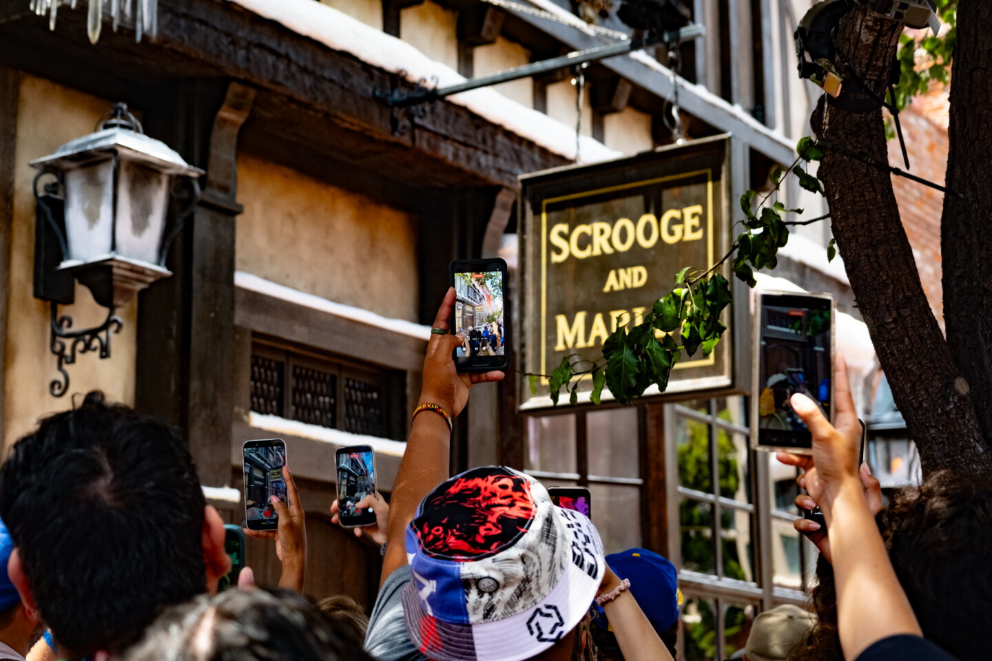 Comic-Con attendees snap photos of the "Scrooge and Marley" pop-up, hoping to catch Johnny Depp, who did a surprise appearance in costume the day before, July 24, 2026.