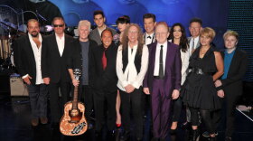 Musicians Raul Malo, Boz Scaggs, Graham Nash, Gabe Saporta, Paul Anka, Victoria Asher, Waddy Wachtel, Chris Isaak, producer Peter Asher, Michelle Branch, Lyle Lovett, Shawn Colvin and Patrick Stump take a cast photo for the concert held at Hollywood's Music Box Theatre in celebration of what would have been Buddy Holly's 75th birthday, September 7, 2011.