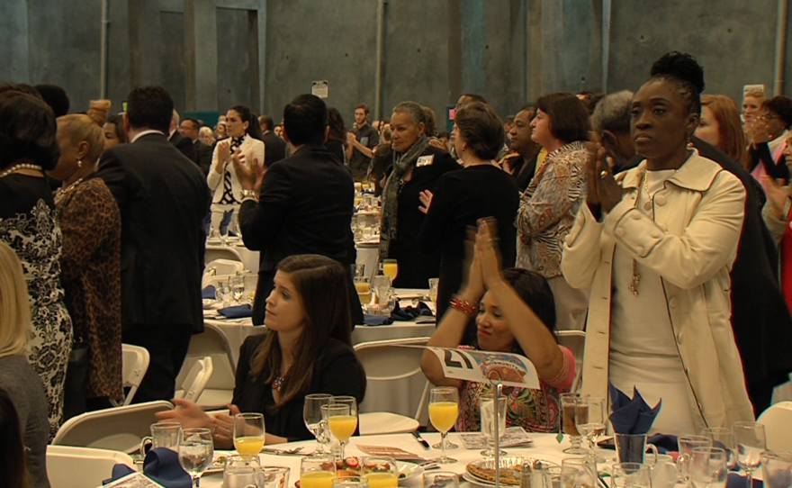 Attendees of the 28th annual All Peoples Breakfast applaud keynote speaker John Carlos Frey, Jan. 18, 2016.