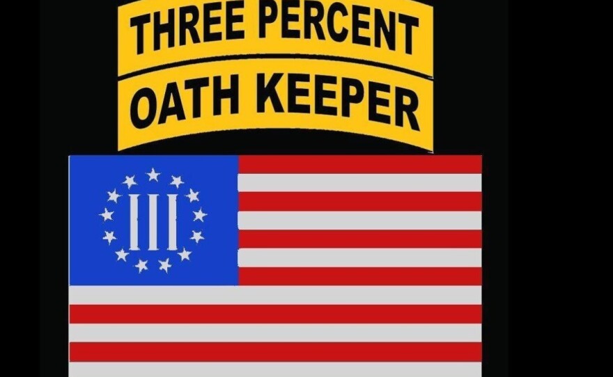 A Facebook profile that matched identifying details of a Chicago Police Department uniformed employee included this picture, which suggests ties to the Oath Keepers, as well as another extremist group, the Three Percenters. The employee said he does not have Facebook. A day after he spoke with NPR, this photo and others that displayed Oath Keepers iconography had been removed from the profile.