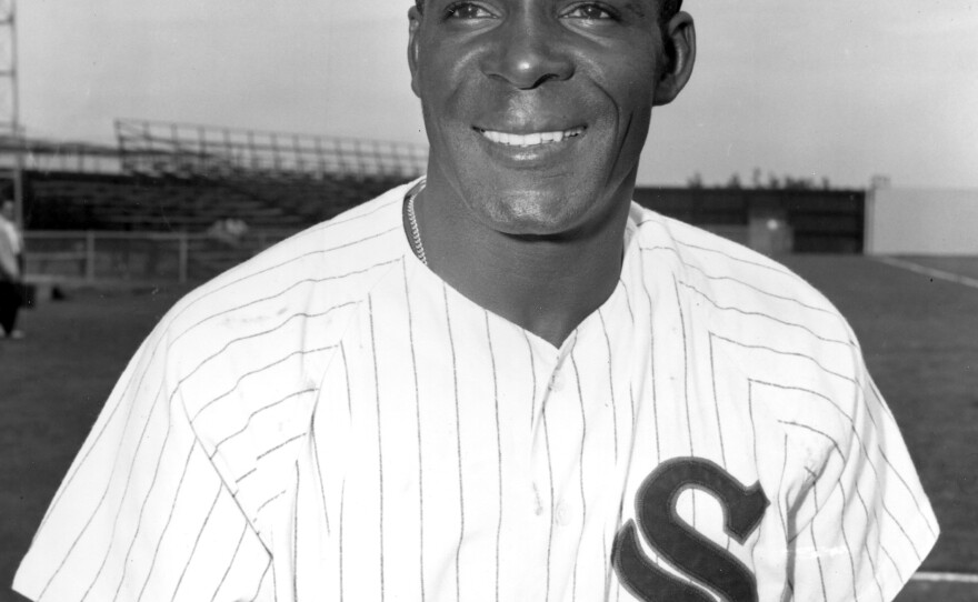 Chicago White Sox outfielder Orestes "Minnie" Minoso smiles in Tampa, Fla., on March 9, 1957. Minoso, who was born near Havana, Cuba, became the first black player with the White Sox when he was traded in 1951 by the Cleveland Indians.