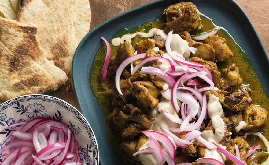 Jerusalem-Style Mixed Grill Chicken with tahini sauce and pickled onions.