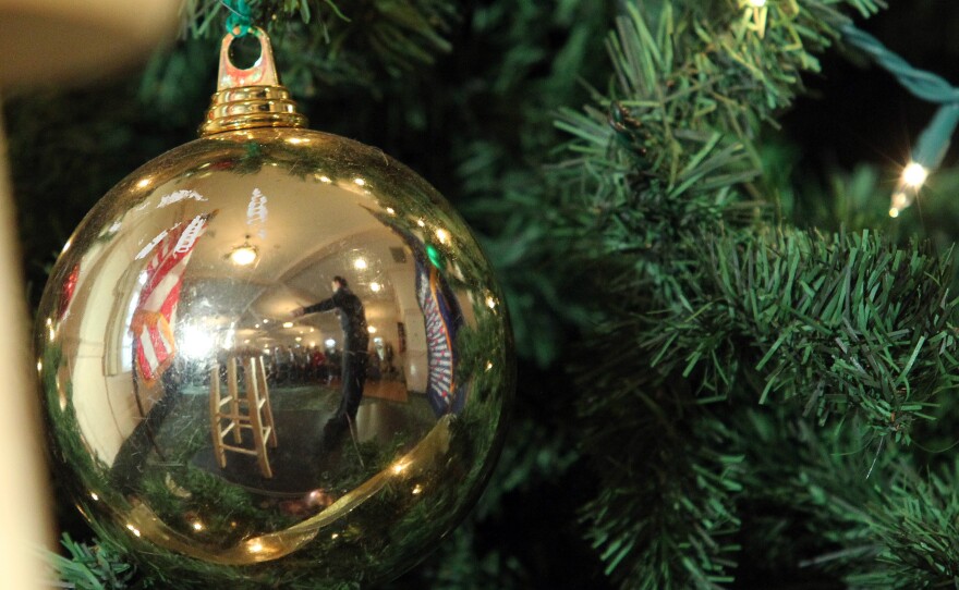 Republican presidential candidate Sen. Marco Rubio, R-Fla., reflected in a Christmas tree ornament during a campaign stop in New Hampshire.