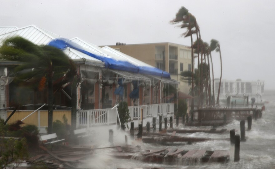 Heavy waves caused by Hurricane Matthew pound the boat docks at the Sunset Bar and Grill on Cocoa Beach, Fla., on Friday. Hurricane Matthew passed by offshore as a Category 3 hurricane, bringing heavy winds and minor flooding.