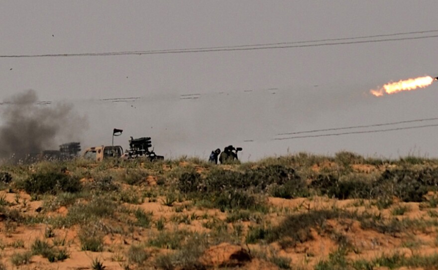 Rebels fired missiles at forces loyal to Libyan leader Moammar Gadhafi near the town of Bin Jawad.