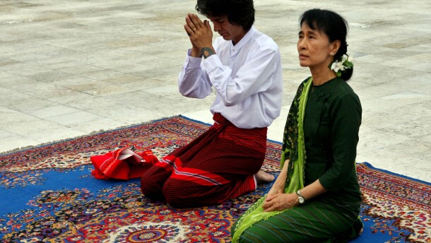 Aung San Suu Kyi, right, and her youngest son Kim Aris pay respect to the late Gen. Aung San, father of Suu Kyi, at the Martyr's Mausoleum in Yangon, Myanmar, Tuesday, July 12, 2011.