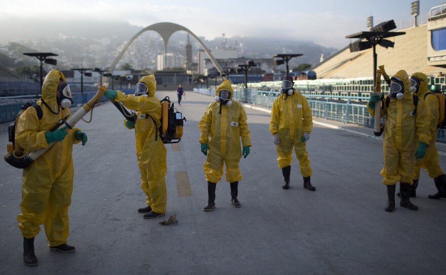 Health workers get ready to spray insecticide to combat the Aedes aegypti mosquitoes that transmits the Zika virus in January, under the bleachers of the Sambadrome in Rio de Janeiro, which will be used for the Archery competition in the 2016 summer games.