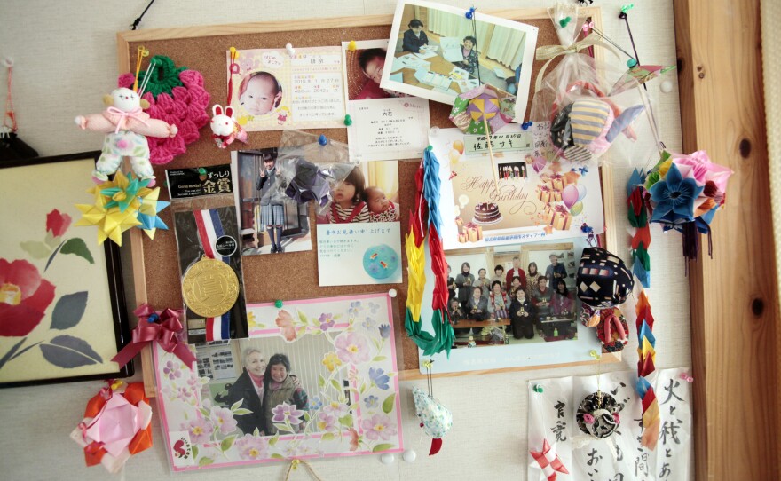 Pictures and letters decorate a wall of Saki Sato's temporary home.