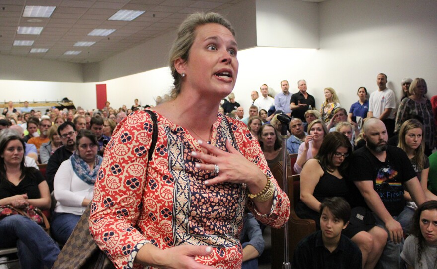Mother-of-three Cole Kelley expresses her concerns about the landfills at a community meeting in October. Kelley lives in the St. Louis suburb of Ladue, about nine miles away from Bridgeton, where the landfills are located. She was one of about 500 area residents to attend the meeting.