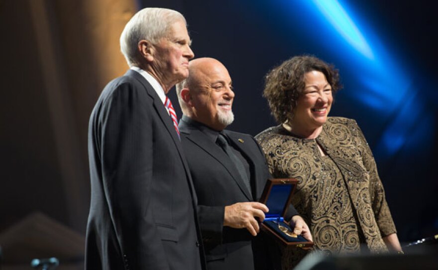 Billy Joel (center) receives the Library of Congress Gershwin Prize for Popular Song from Dr. James H. Billington, the Librarian of Congress (left) and U.S. Supreme Court Justice Sonia Sotomayor (right). Taped November 19, 2014, at DAR Constitution Hall in Washington, D.C.