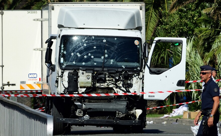 Forensic police investigate a truck at the scene of a terror attack on the Promenade des Anglais on Thursday evening in Nice, France. A French-Tunisian attacker killed 84 people as he drove a truck through crowds gathered to watch a fireworks display during Bastille Day celebrations.
