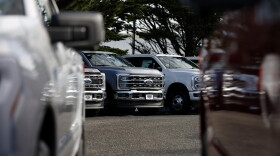 COLMA, CALIFORNIA - JANUARY 06:  Ford pickup trucks are displayed on the sales lot at Serramonte Ford on January 06, 2026 in Colma, California.