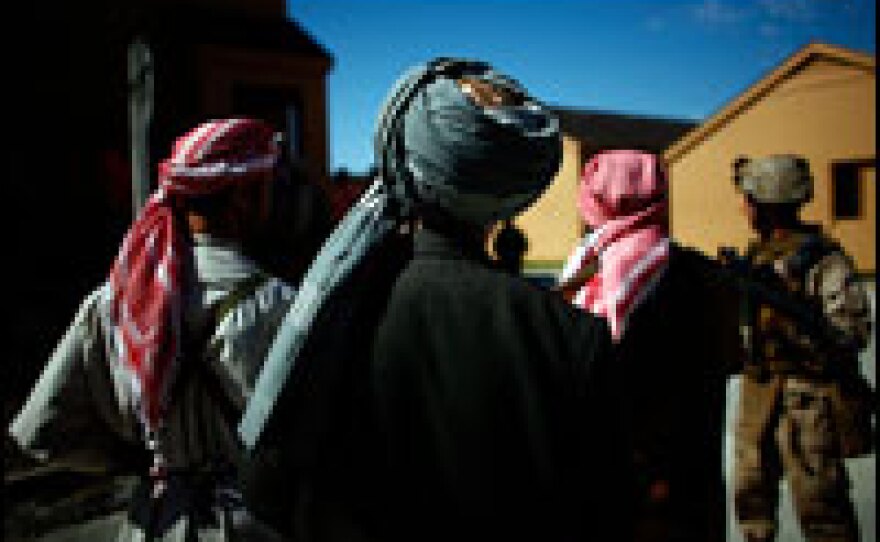 Actors play the role of translators, villagers and the Taliban during a training patrol at Camp Lejeune. The Marines are preparing for austere conditions in Afghanistan and communications with families back home will be difficult.