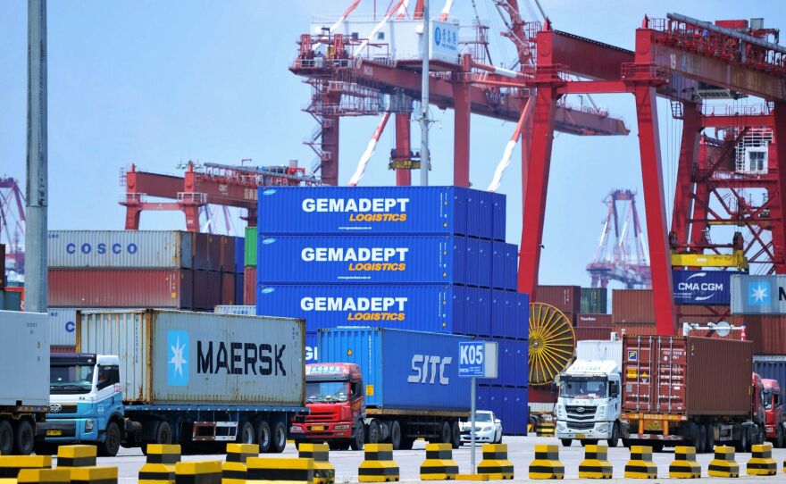 Containers are transferred at a port in Qingdao in China's eastern Shandong province last week. The Trump administration announced plans to levy tariffs on another $200 billion of Chinese goods as trade tensions escalate.