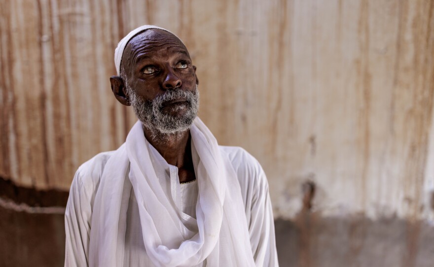 Mohammed Khair, 64, poses for a portrait at his home in old Omdurman, Sudan, on Sept. 6.