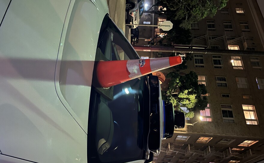 A Waymo driverless car gets coned in San Francisco.