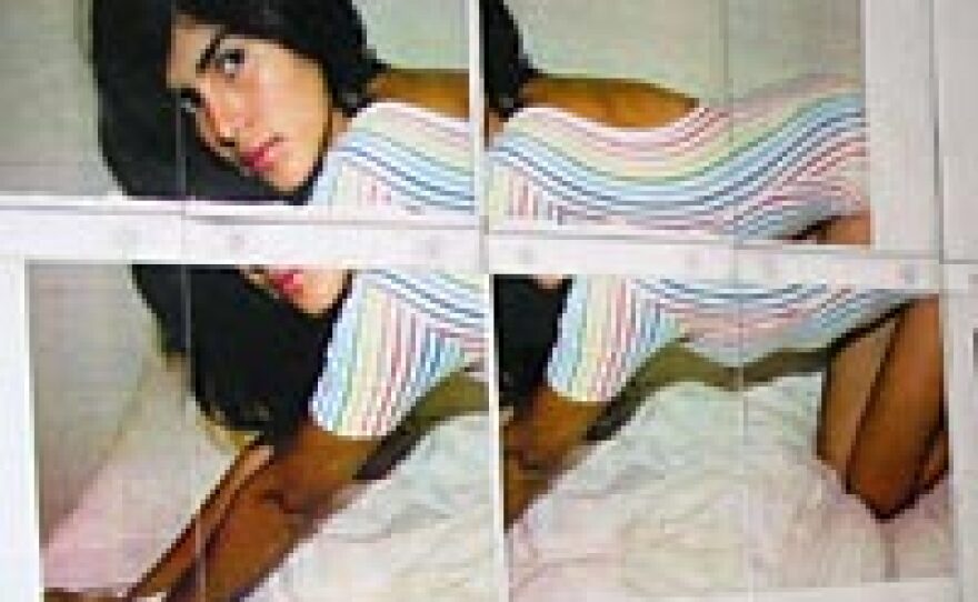 American Apparel is often criticized for its ad campaigns featuring very young, scantily clad models. Posters from the campaign line the walls of the garment factory.