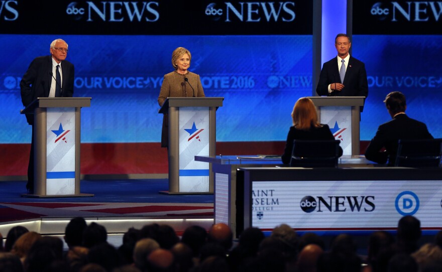 Bernie Sanders, Hillary Clinton, center, and Martin O'Malley on stage at the Democratic presidential primary debate Saturday at Saint Anselm College in Manchester, N.H.