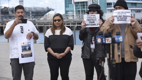 From left to right, Benjamin Prado, an organizer with Unión del Barro, former Disney Cruise passenger Dharmi Mehta and two unidentified activists are pictured at the B Street Pier on May 5, 2026.