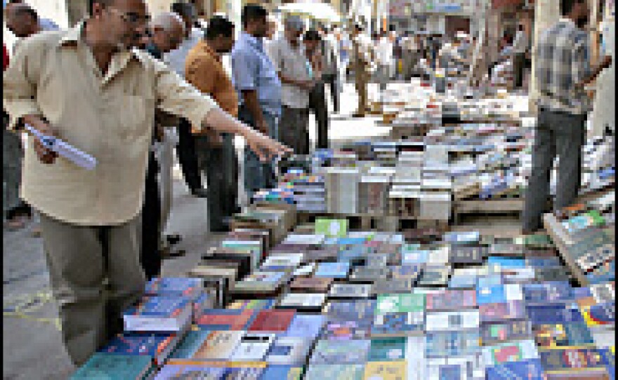 Iraqis gather at the weekly open air book fair at al-Mutanabi street in central Baghdad in May 2006. Bookstores of every description occupied al-Mutanabi's street-level spaces, selling technical manuals, ornate copies of the Quran and a nice selection of pirated software.