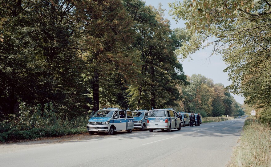 Police cars line up outside Hambach Forest. The eviction of activists began on Sept. 13, 2018. For five days, special forces and police destroyed the treehouses and arrested activists — until a journalist fell from a tree and died, halting the process.