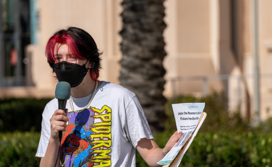 Youth climate activist Theo Martien delivers a speech during a youth climate strike in San Diego, March 25, 2022.