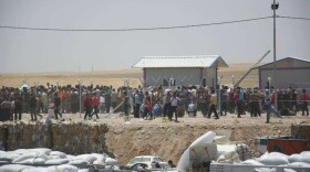 Iraqis fleeing violence in Mosul arrive in the Kurdistan region, June 11, 2014.