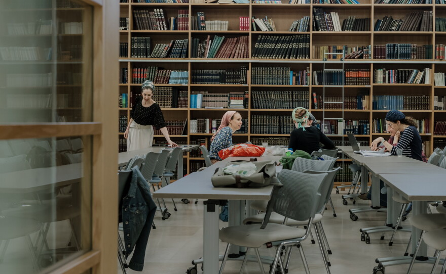 Students work in small study groups during a Torah class.