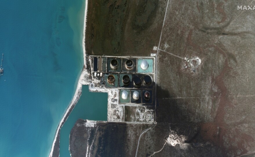 A satellite image taken Friday shows damage and oil leaking from a terminal on Grand Bahama. The company that owns it says 1.8 million barrels were being stored there when Hurricane Dorian hit late Sunday.