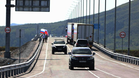 In this photo released by the Government of Primorsky Krai Region on Monday, Sept. 7, 2026, vehicles drive across the new bridge between Russia and North Korea named after the Soviet officer Yakov Novichenko, who is credited with saving North Korea's founding leader, Kim Il-sung, over the Tumannaya River in Primorsky Krai Region of Russia.