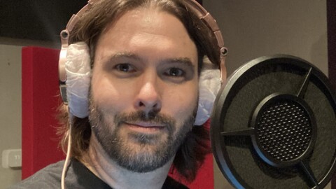Voice actor Jon Allen stands in front of a mic for a recording session in this undated photo. 