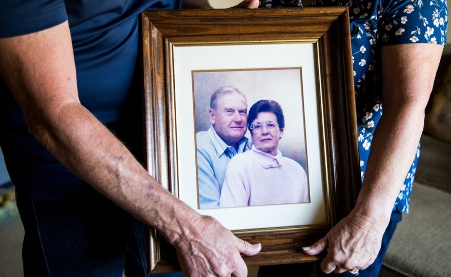 Mark and Kathy Allen hold a photo of Mark's parents at their home in Sebastopol on July 29, 2020. Mark and Kathy evacuated Mark's mother and several other residents of the Villa Capri retirement community as the Tubbs Fire approached in October 2017.
