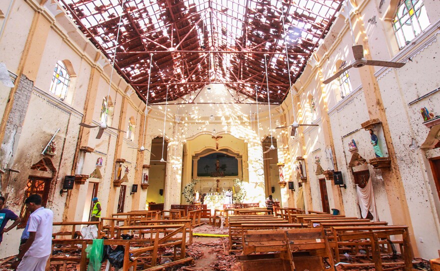 Sri Lankan officials inspect St. Sebastian's Church in Negombo, north of Colombo, Sri Lanka's capital, after a series of explosions on Easter Sunday at churches and hotels across Sri Lanka killed nearly 300 people and wounded hundreds more.