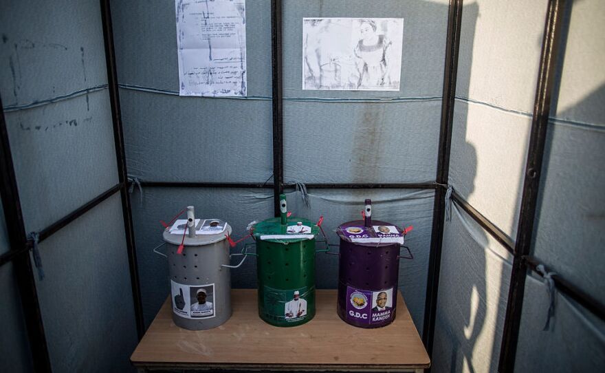 Voting drums with the emblem of the candidates in a Banjul polling station.