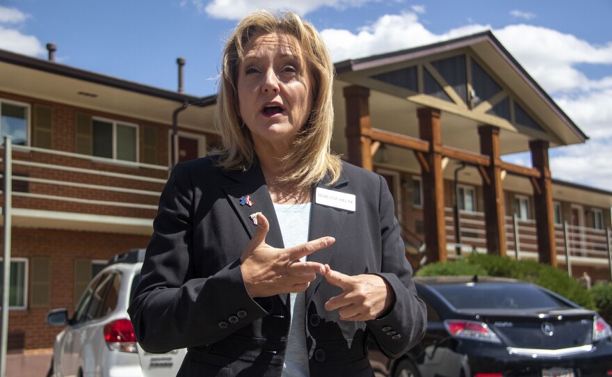 Activist and former U.S. House candidate Rebecca Keltie stands on May 31 outside of a Colorado Springs apartment building where she went looking for irregularities in the 2020 election.