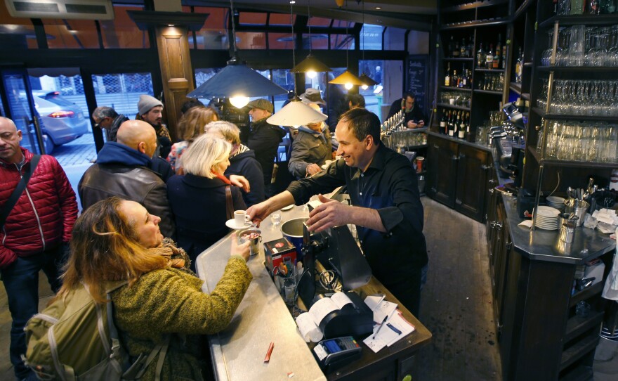 Customers turned out Friday at the Bonne Biere cafe, reportedly the first Paris cafe that was attacked to reopen.