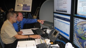 Military and civilian personnel work together to test new emergency response software at SDSU’s  Visualization Center.